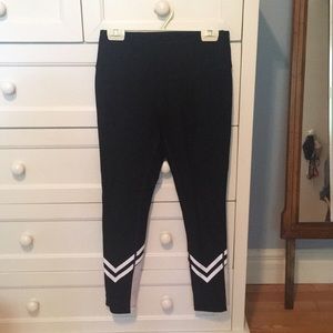 Full length black leggings with white detail.